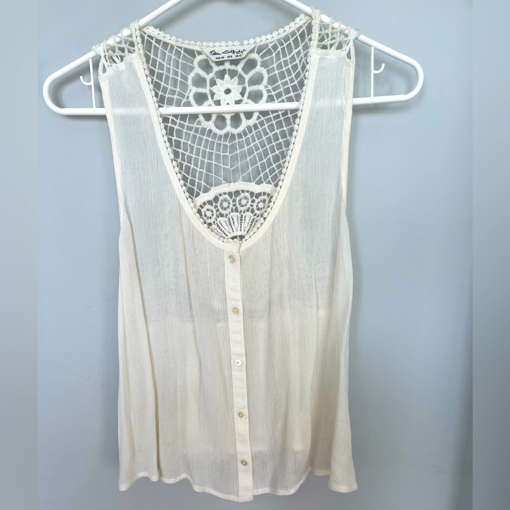 Sheer cream tank style top.